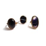 A gold ring mounted with an oval blue john, a gold ring mounted with an oval moulded intaglio,