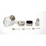 A silver three piece condiment set, comprising; a salt, a pepperette and a mustard pot,