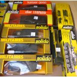 A quantity of vintage solido military die-cast vehicles including; a Kaiser Jeep, a Leopard tank,