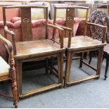 A pair of Chinese walnut open armchairs with pierced splat and solid seat.