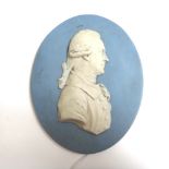 An oval Wedgwood blue jasper portrait medallion by Flaxman, depicting Herschel in relief,