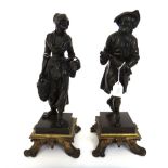 A pair of French bronze figures of street vendors, 19th century,