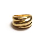 A gold ring, in a ridged abstract design, detailed 750, weight 8.6 gms, ring size P and a half.