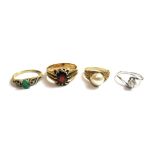 A 9ct gold ring, claw set with an oval cut garnet, a 9ct gold ring,