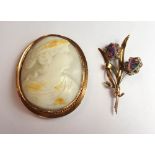 A gold mounted oval shell cameo brooch, carved as the portrait of a lady,