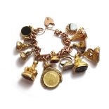 A gold curb link charm bracelet with a gold heart shaped padlock clasp,