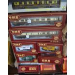 A quantity of 00 gauge coaches, wagons and rolling stock tincluding; Hornby, Airfix, Wrenn,