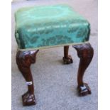 A 19th century carved walnut stool in George III manner,
