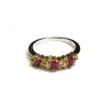 An 18ct white gold, ruby and diamond set ring,