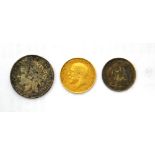 A George V half sovereign 1914, a French franc 1894 and a Swiss half franc 1914.