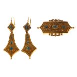 A gold, turquoise and blue paste set three stone brooch, in a shaped rectangular design,