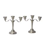 A pair of silver three light table candelabra,