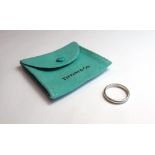 A Tiffany & Co platinum plain wedding ring, ring size N, weight 5 gms, with a Tiffany & Co pouch.