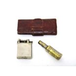 A plated base metal rectangular cased Dunhill petrol lighter, a travelling corkscrew,