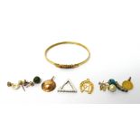 A 9ct gold and gemstone set oval bangle, a USA gold dollar 1849, mounted as a pendant,