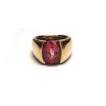 A gold and pink tourmaline set single stone ring,