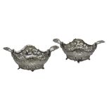 A pair of late 19th century European twin handled bonbon bowls, each of shaped oval form,