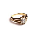 An 18ct gold and diamond set single stone ring,