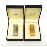 A gold plated Dunhill rectangular gas lighter, with bark textured decoration,
