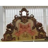 An Italian Baroque Revival polychrome painted bed headboard, 200cm wide x 147cm high.