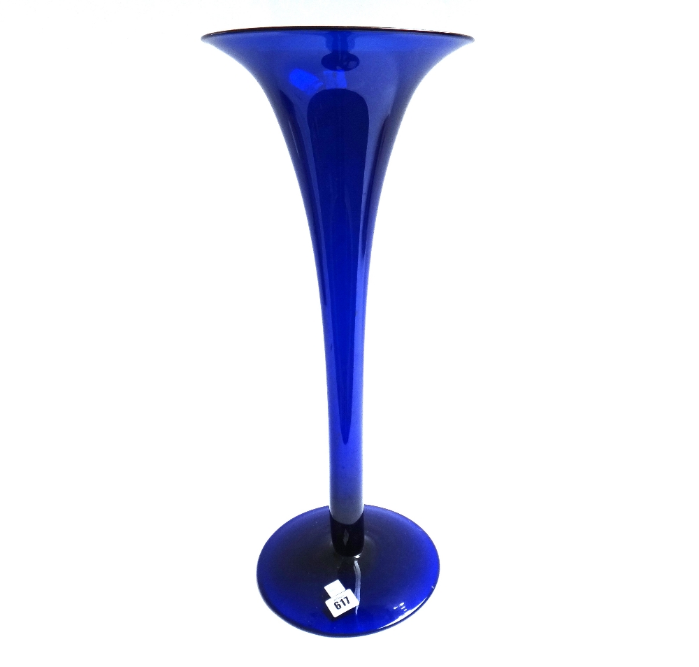 A Bristol blue glass vase of slender trumpet form, on a large circular foot, 56.5cm high.