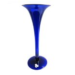 A Bristol blue glass vase of slender trumpet form, on a large circular foot, 56.5cm high.