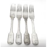 Four Victorian silver fiddle pattern table forks, crest engraved, London 1860, weight 331 gms.