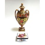 A Copeland porcelain vase, circa 1900, of two handled urn form, decorated in a gilt Imari pattern,