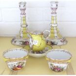 A group of 19th century Dresden yellow ground porcelain, comprising; a pair of candlesticks, crossed