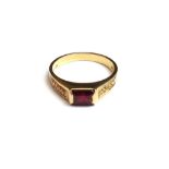 An 18ct gold ring, mounted with a rectangular step cut ruby at the centre,