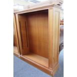 A 20th century oak floor standing open bookcase on plinth base, 125cm wide.