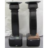 A pair of ebonised pedestals with swivel tops and stepped square bodies, (a.f.).