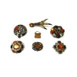 A Scottish style vary coloured agate set brooch, designed as a shield within a garter,