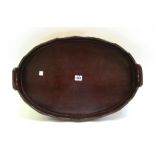 A 19th century brass bound coopered oval serving tray, 54cm wide, together with another similar,