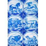 A framed set of six Dutch Delft blue and white tiles by Ravesteijn, Utrecht, late 19th century,
