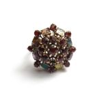 A gold, garnet and vary coloured gem set cluster ring, (one garnet lacking), ring size M and a half.
