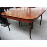 A Regency mahogany extending dining table on tapering turned supports with three extra leaves,