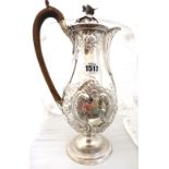 A George III silver hot water jug, of baluster form, with floral,