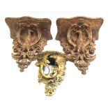 A pair of late 18th/ early 19th century continental carved giltwood wall brackets modelled as birds