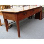 A 19th century French plank top cherry wood preparation table with three frieze drawers,