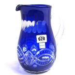 A part suite of blue flashed glass wares including; two jugs, ten tumblers and eight wine glasses,
