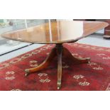 A George III crossbanded mahogany rectangular snap top breakfast table on four downswept supports