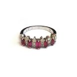 A white gold, ruby and diamond set ring,