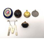 A bloodstone triple sided rotating pendant fob seal, an Eastern coin mounted as a pendant,