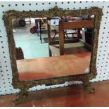 A gilt framed strut mirror.