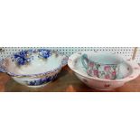 A blue and white pottery wash bowl, another wash bowl, a jug and a chamber pot.