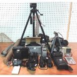 A quantity of 20th century photographic equipment, tripods, cameras and sundry.