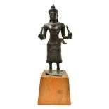 A Khmer bronze figure of a female deity, 13th century,