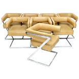 A set of eight 20th century chrome framed leatherette upholstered tub back chairs in the manner of