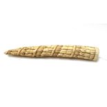 An African ivory tusk, 19th century, carved with bands of ethnic figures, 25cm.